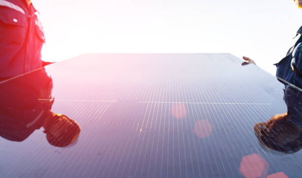 istock Technician is lifting the solar cell to replace the damaged one, Alternative energy to conserve the world's energy, Photovoltaic module idea for clean energy production 1351395848