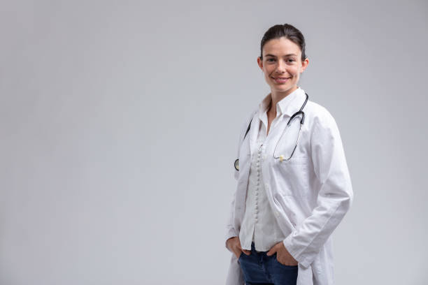istock Relaxed young woman doctor with a warm friendly smile 1351405829