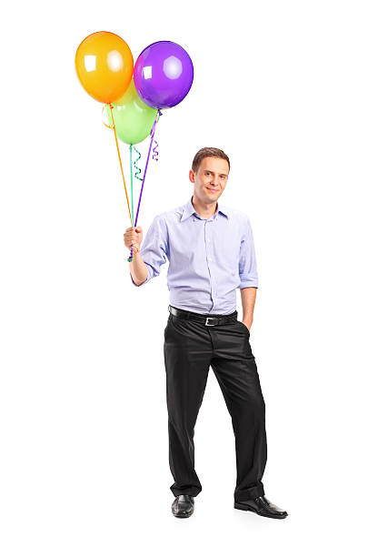 istock Smiling man holding balloons 135140791
