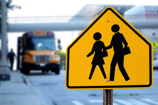 Traffic sign. School zone yellow warning board.