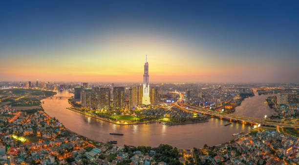 aerial view of Ho Chi Minh city, Vietnam, beauty skyscrapers along river light smooth down urban development stock photo