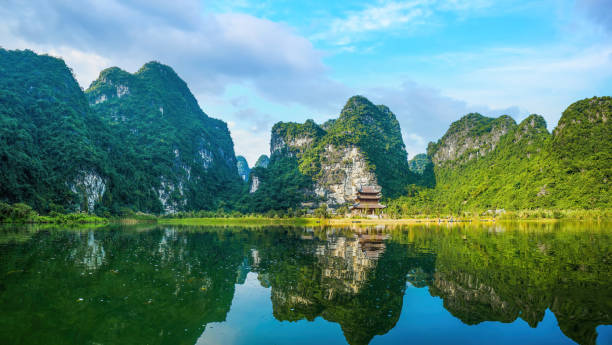 Boat cave tour in Trang An Scenic Landscape. Trang An is UNESCO World Heritage Site. It's Halong Bay on land Ninh Binh province, Vietnam stock photo