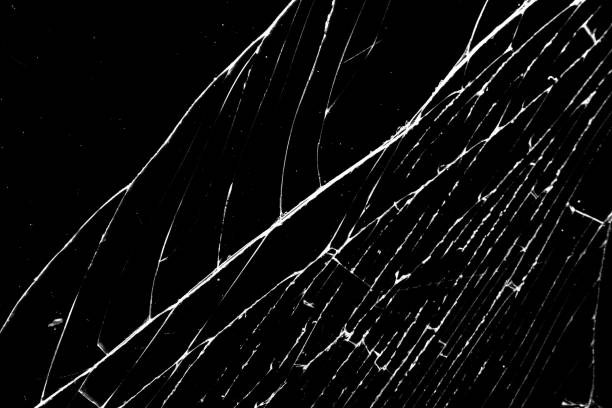 istock cracked glass isolated on a black background. broken glass 1351416334