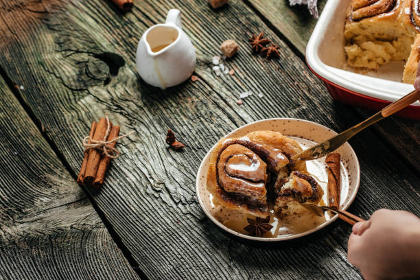 istock Cinnabon Cinnamon rolls on a plate on a wooden table. banner, menu, recipe place for text, top view 1351417281