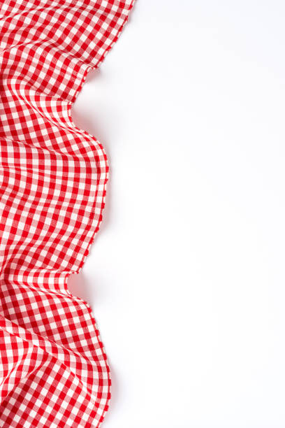 istock Overhead shot of red checkered table cloth with copyspace 1351418135