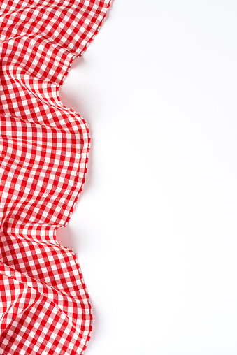 Overhead shot of red checkered table cloth with copyspace