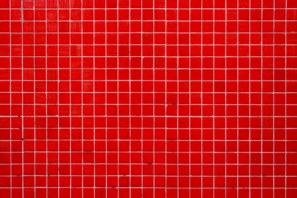 wand aus roten mosaikfliesen - red tile stock-fotos und bilder