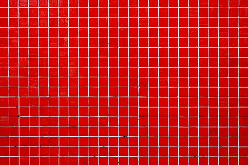 Background from a wall made of red mosaic tiles