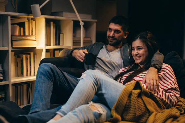 istock Couple relaxing at home. night scene 1351418524