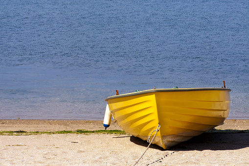 Yellow fishing rowboat on harbor dock , Cambados, O Salnés, Pontevedra province, Galicia, Spain.