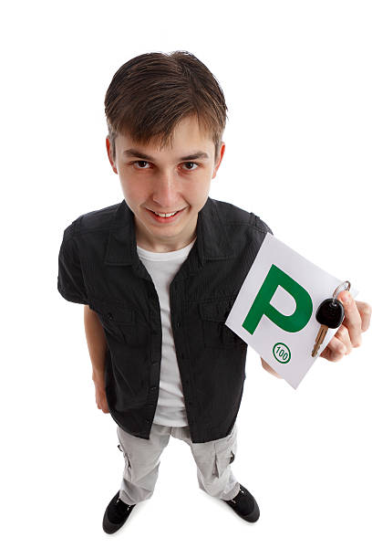 istock Teenager with green P licence plates 135142076