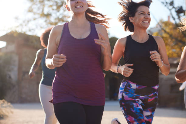 istock Women running and having fun outdoor. 1351421661