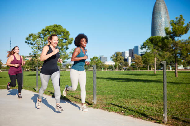 istock Three women exercissing in a city park. 1351422393