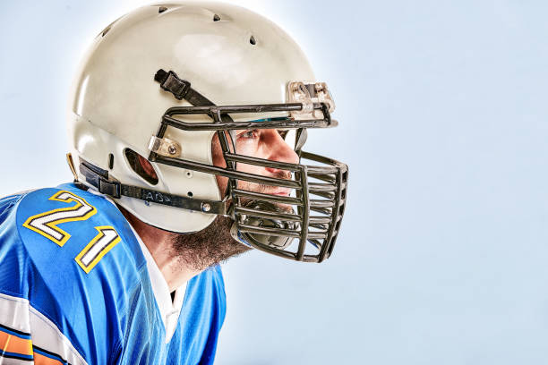 istock American football player posing on white background 1351424946
