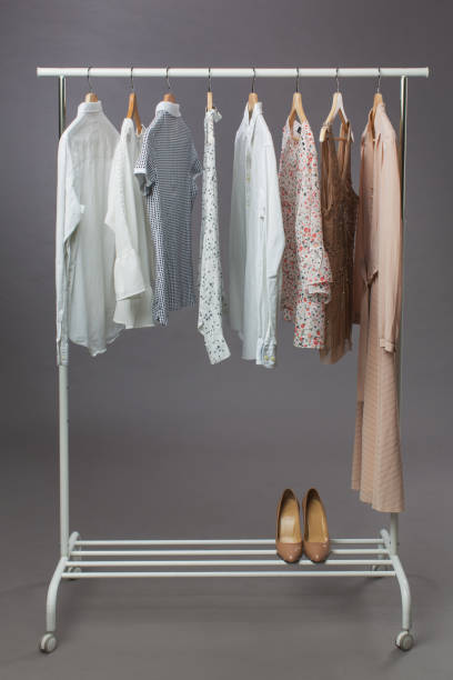 istock Woman's clothes in pastel colours hanging on rail 1351426427