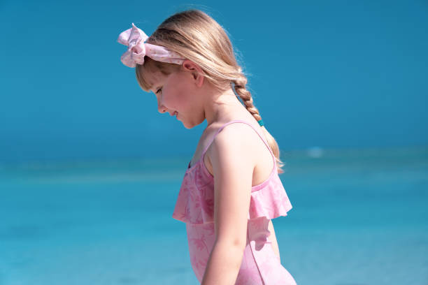 https://media.istockphoto.com/id/1351426742/photo/a-young-girl-on-the-tropical-beach-7-years-old.jpg?s=612x612&w=0&k=20&c=g2A6Igz36ToXOQwgYL_TJEQGZFlUOpVvu7b-8AnWAWw=