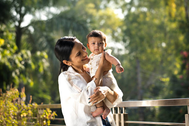istock Mother playing with her baby boy in balcony 1351427677