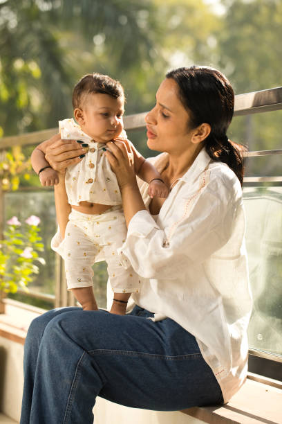 istock Mother playing with her baby boy in balcony 1351429718