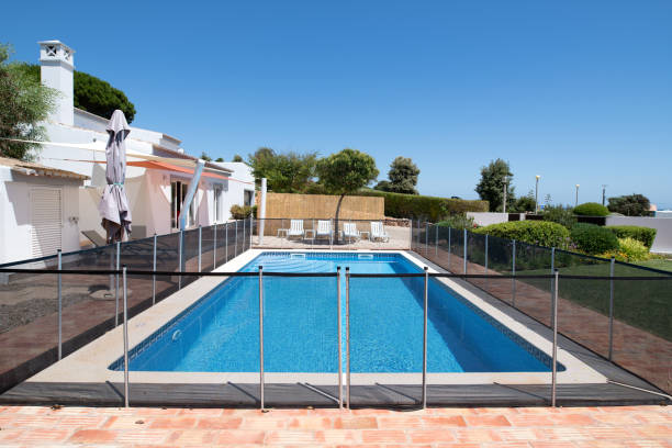 Fenced swimming pool stock photo