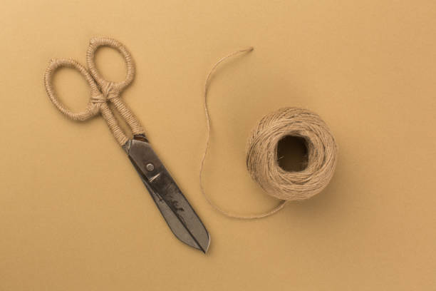 istock Vintage scissors on paper background 1351430930