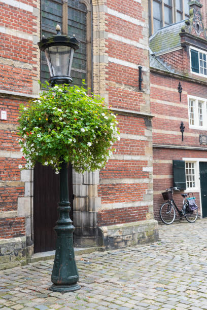 istock old street lamp with flower pot 1351432147
