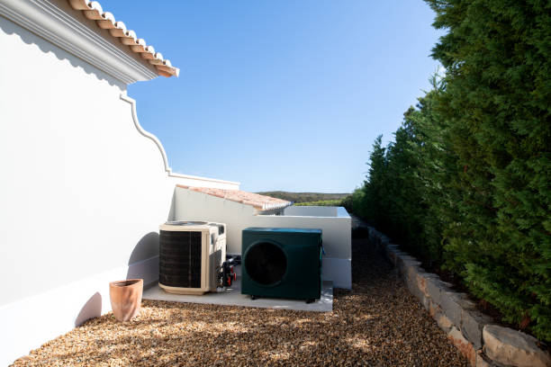 two pool heaters, one old and one new - house residential structure two objects building exterior imagens e fotografias de stock