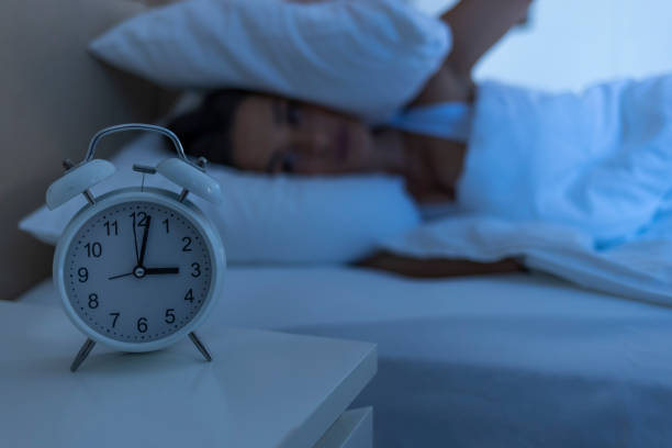 istock Woman with insomnia lying in bed with open eyes. 1351432624