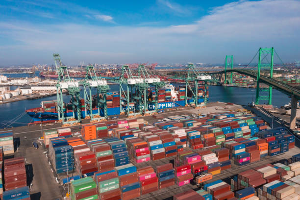 Port of San Pedro in Los Angeles CA with San Vicente Bridge in the Long Beach area with shipping containers stuck at harbor stock photo