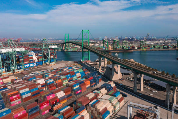 Port of San Pedro in Los Angeles CA with San Vicente Bridge in the Long Beach area with shipping containers stuck at harbor stock photo