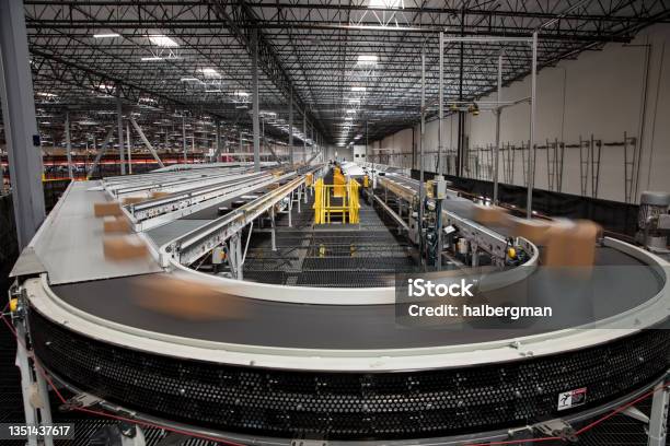 Long Exposure Of Packages On Conveyor Belt Stock Photo - Download Image Now - Conveyor Belt, Warehouse, Supply Chain
