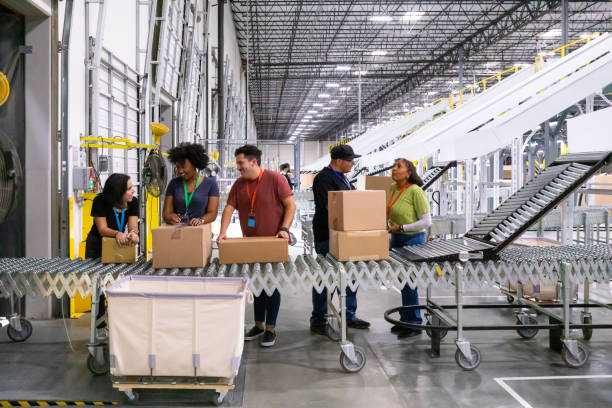 istock Team of Fulfillment Center Workers Chatting at Leading Dock 1351437870