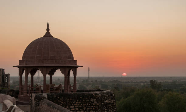 Dawn at Khimsar Fort The rosy light of dawn light up the fortifications and walls of the Khimsar Fort, now transformed into a luxury hotel palace photos stock pictures, royalty-free photos & images