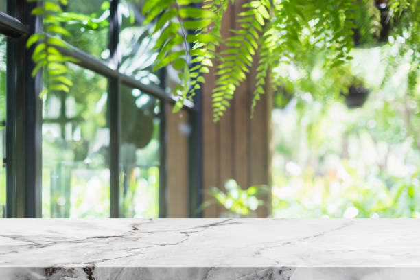 istock Empty white marble stone table top and interior space of cafe and restaurant banner mock up abstract background - can used for display or montage your products. 1351439107
