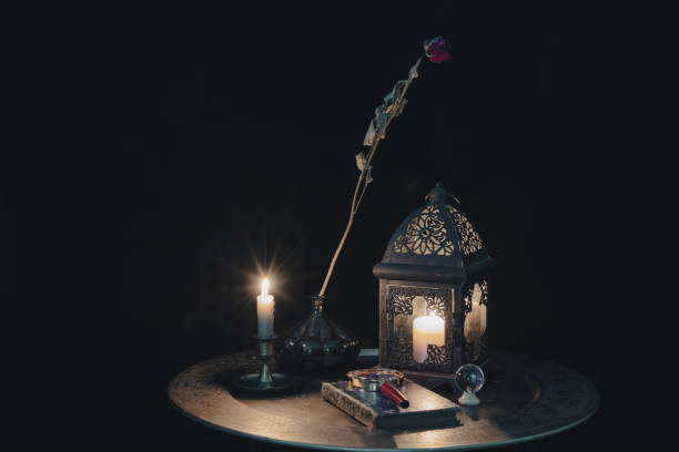 istock Mystery night. Scene of reading the future with crystal ball and magic elements. 1351439347