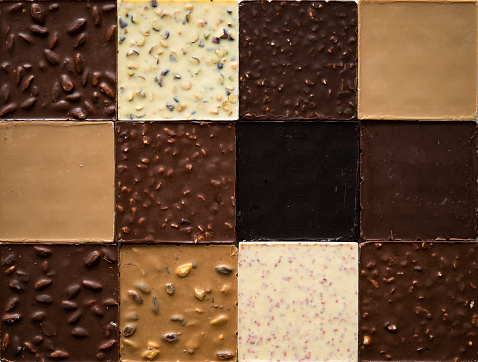Top view of regular assortment of milk, dark and white chocolate bars.