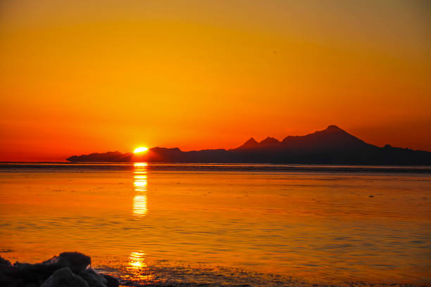 Sunsetting behind Iliamna volcano on Cook Inlet Alaska