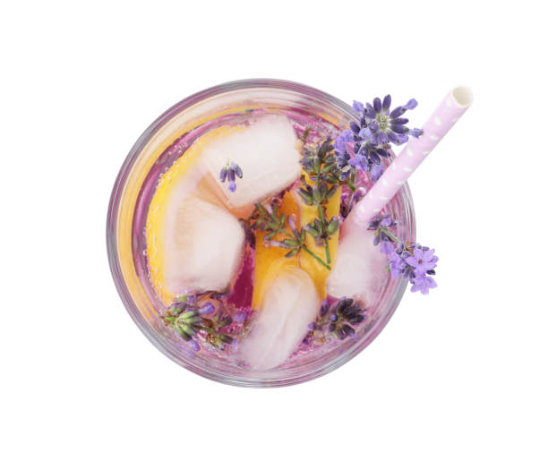 istock Fresh delicious lemonade with lavender and straw isolated on white, top view 1351442532