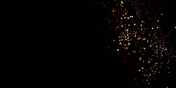 istock Golden abstract bokeh on black background. 1351443449