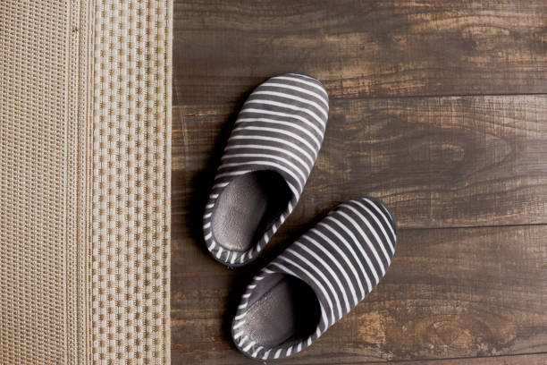 istock Slippers on the brown parquet floor 1351443591