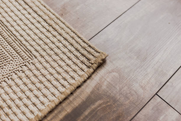 istock Laminate parquete floor with beige soft carpet 1351443594