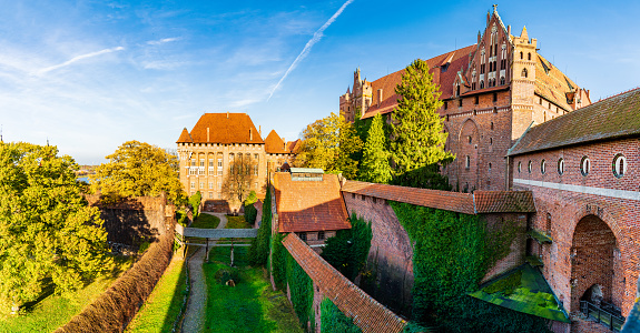 Malbork - The Castle of the Teutonic Order in a sunny autumn day. Blue sky on the background.
