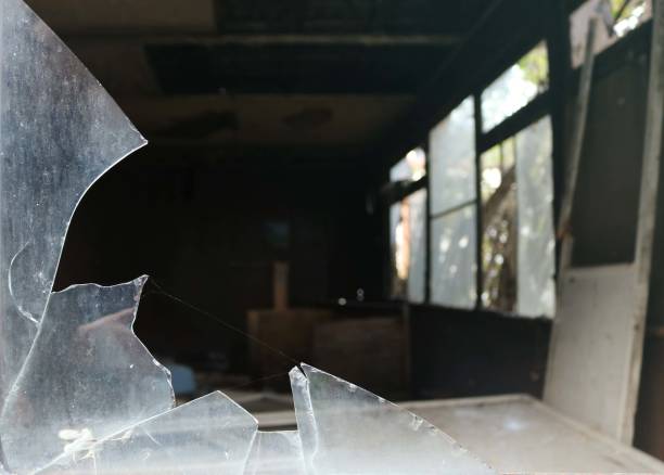 istock spooky dark room in an abandoned house with misplaced objects and broken glass windows - creepy scenario 1351443897