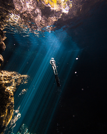 istock Surfacing in a Warm Cenote 1351443931