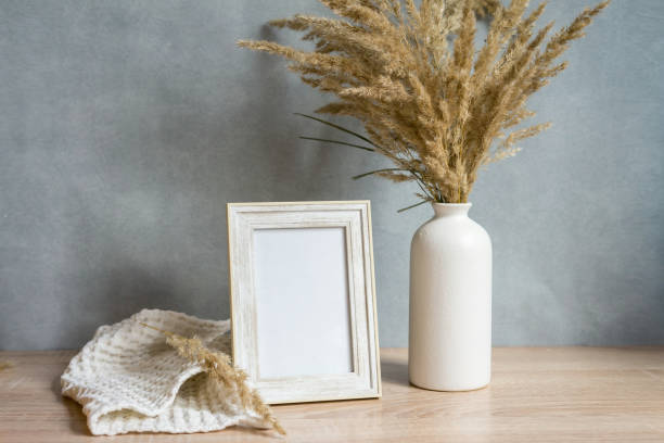 istock Portrait frame mock up with dried flowers 1351444004