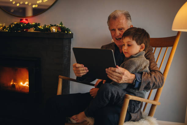 istock Grandfather and grandson using a digital tablet 1351444251