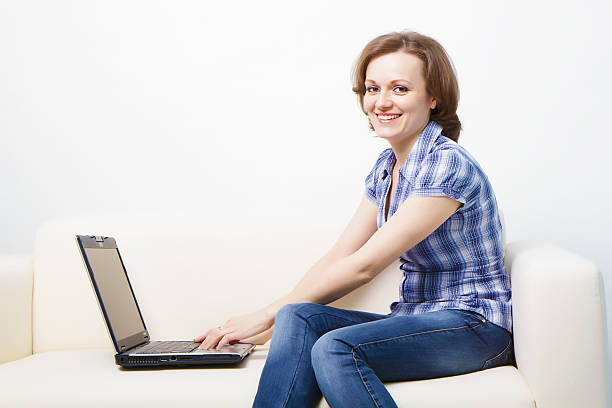 istock young slender woman with a laptop 135144438