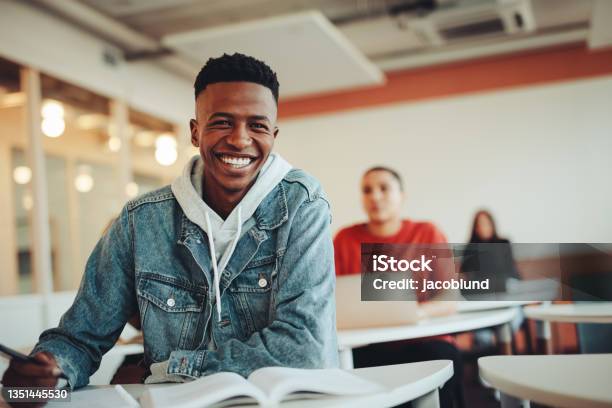 African Student Sitting In Classroom Stock Photo - Download Image Now - Student, Teenager, University Student