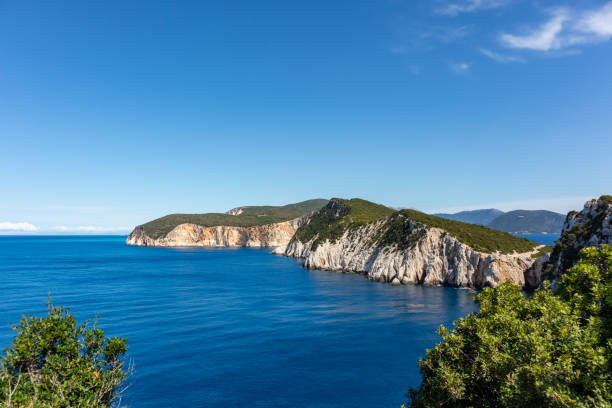 istock Lefkada sea shore cliffs with vivid blue sea view 1351446255