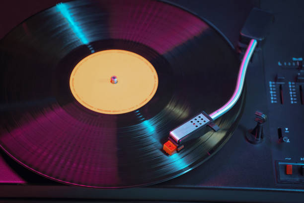 istock Retro vinyl record player is playing the LP album. 1351449303