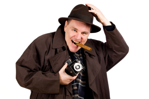 Old-style photographer with vantage camera and cigare